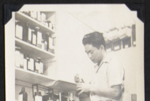 Gary Kikawa at Rohwer pharmacy (ddr-densho-542-693)