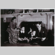 Family reading in front of fireplace (ddr-densho-1007-650)
