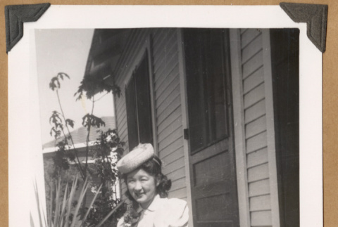 Anna Nose sitting on a porch (ddr-densho-542-57)