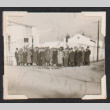 Group photo in winter coats outside buildings (ddr-densho-468-440)