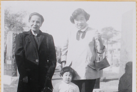 Yoshiko and Susan Shiomi with unidentified woman in cemetery (ddr-densho-522-316)