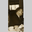 Man seated at a table (ddr-njpa-2-563)