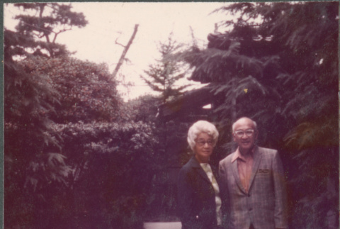 Agnes and Chester Sakura standing on walkway (ddr-densho-523-563)