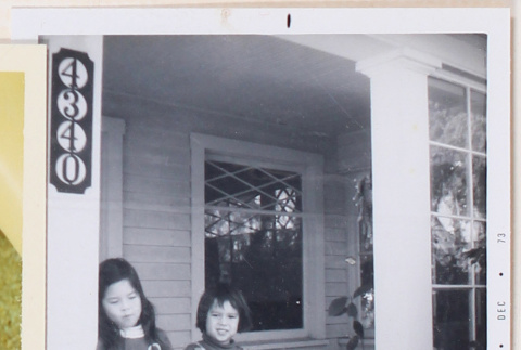 Photo of two children on a porch (ddr-densho-483-431)