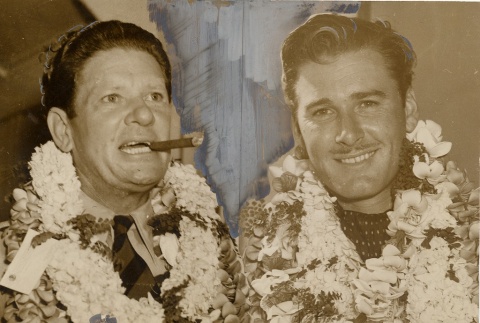 Two men wearing leis (ddr-njpa-1-301)