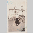 Woman standing on street corner (ddr-densho-464-83)