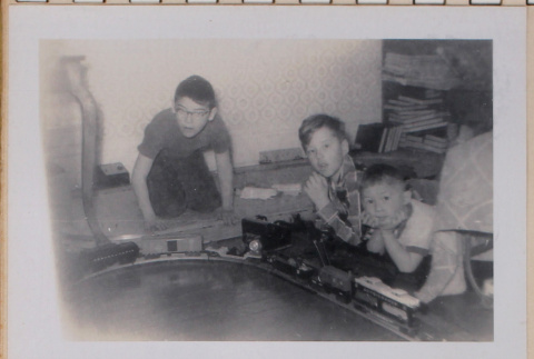 Boys playing with train set (ddr-densho-462-266)