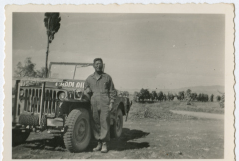 Soldier standing next to jeep (ddr-densho-368-57)
