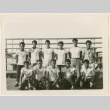 Basketball team seated on bleachers (ddr-densho-37-1025)
