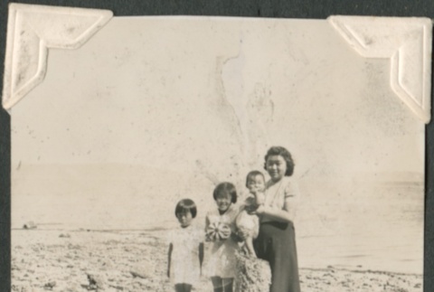 Woman with three children at the beach (ddr-densho-321-32)