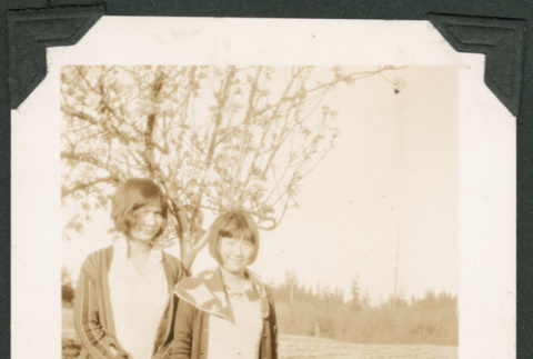 Photo of Mary Fukuyama and Elsie with plum trees (ddr-densho-483-303)