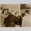 Wang Jingwei and other men giving cheers (ddr-njpa-1-1073)