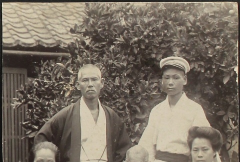 Family portrait in Japanese garden (ddr-densho-259-134)