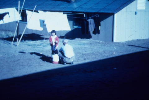 Japanese Americans outside barracks (ddr-densho-160-35)