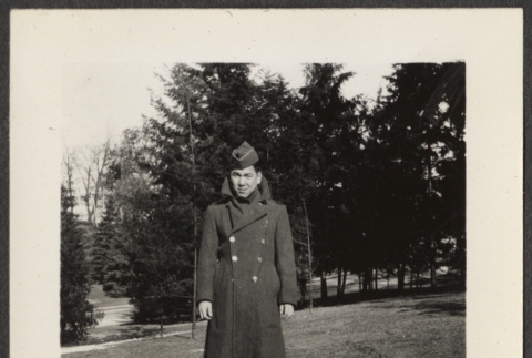 Soldier on a grassy hill (ddr-densho-433-1032)