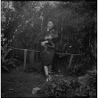 Tomoye (Nozawa) Takahashi holding a cat (ddr-densho-426-1747)