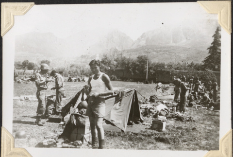 Men by tents in field (ddr-densho-466-648)