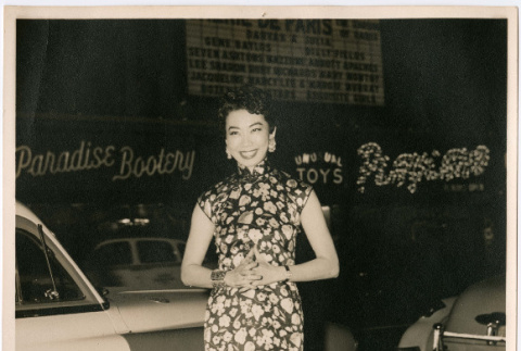 Mary Mon Toy standing on street outside marquee for Cafe de Paris (ddr-densho-367-152)