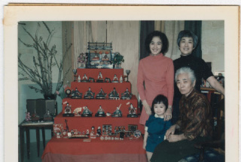 4 generations of Sumida women posing in front of Japanese doll collection (ddr-densho-379-445)