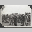 Men on dock looking at ship (ddr-densho-466-146)