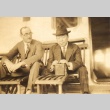 Two men seated on lounge chairs (ddr-njpa-4-17)