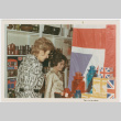 Tomoye Takahashi with unknown woman by British themed product display (ddr-densho-426-1096)