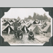 Three men in front of rows of tents (ddr-ajah-2-259)