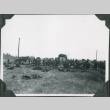Men in field with gear and loading trucks (ddr-ajah-2-241)