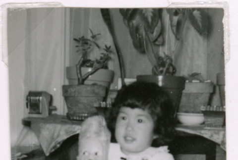 Susan Isoshima with doll (ddr-densho-477-232)