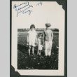 3 kids outside in front of a train (ddr-densho-378-722)