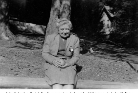 Bertha Starkey sitting on a log (ddr-densho-336-57)