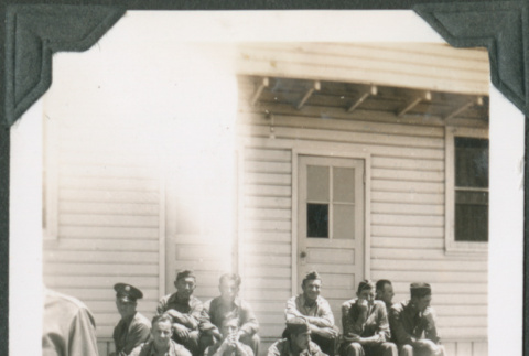 Group of men sitting on steps (ddr-ajah-2-111)