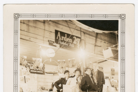 Four men standing at fruit stand photo (ddr-densho-540-20)