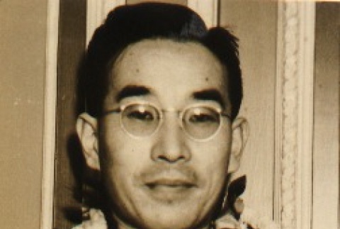 Morinosuke Kawasaki wearing leis after arriving on the Tatsuta Maru (ddr-njpa-4-573)
