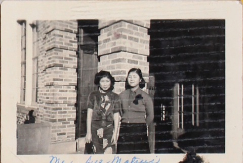 Two women standing at entrance to building (ddr-densho-464-128)