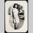 Doris Yuki leans against a tree (ddr-densho-542-617)