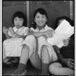 Young Japanese Americans sitting in shade (ddr-densho-151-405)