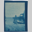 Man standing by a truck (ddr-densho-329-1379)