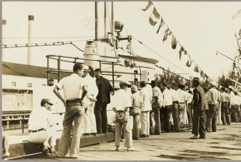 Civilians looking at the navy submarine Argonaut (ddr-njpa-13-365)