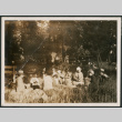 Group of people at a picnic in field (ddr-densho-483-557)
