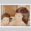 Kellie Dawn Isoshima held by her mom Karlyne (Omoto) Isoshima (ddr-densho-477-467)