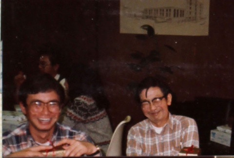 Three men sitting around table (ddr-densho-426-1269)