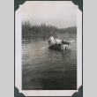 Photo of four people in a row boat (ddr-densho-483-1253)