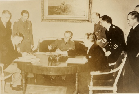 Joachim von Ribbentrop signing Document at a desk (ddr-njpa-1-1465)
