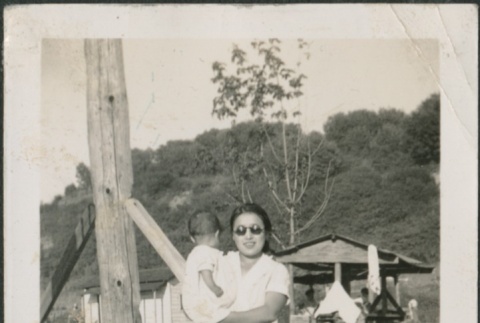 A woman holding a child (ddr-densho-321-724)