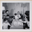 Group playing Monopoly (ddr-densho-522-550)
