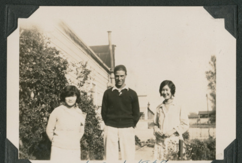 man and two women outside a house (ddr-densho-378-487)