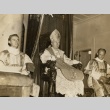James Sweeney and two priests seated on altar, wearing vestments (ddr-njpa-2-936)