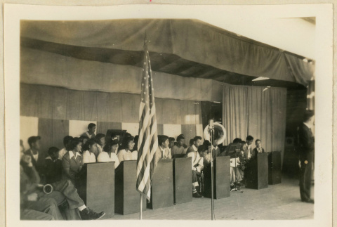 Musicians wait on a stage on Armistice Day (ddr-densho-37-1152)