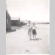 Man and woman walking in camp (ddr-densho-339-3)